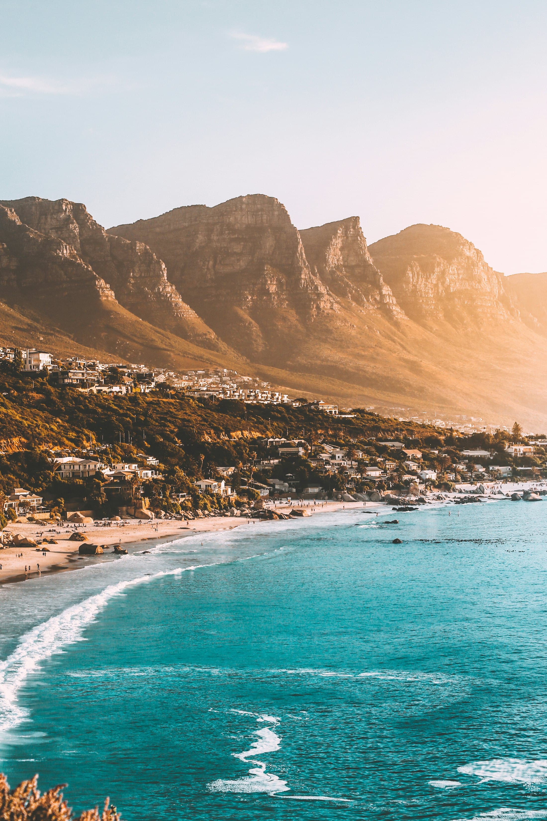 Coastal African landscape where mountains meet the sea at golden hour